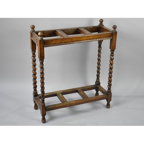 89 - An Edwardian Oak Three Section Stick Stand with Barley Twist Supports, No Trays to Base, 60cms Wide