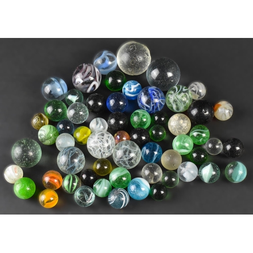 92 - A Collection of Edwardian and Later Glass Marbles of Various Sizes and Designs