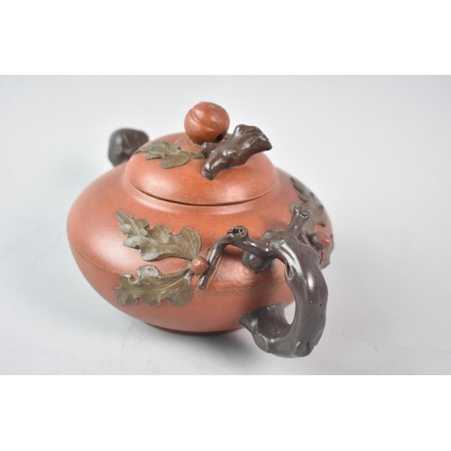 34 - A Reproduction Chinese Yixing Teapot with Stylised Spout and Handle, 20cm long