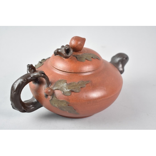 34 - A Reproduction Chinese Yixing Teapot with Stylised Spout and Handle, 20cm long