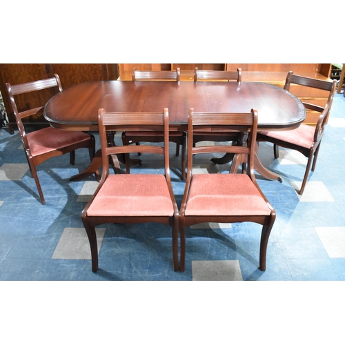 424 - An Oval Mahogany extending Dining Table with One Extra Leaf together with a Set of Six Chairs