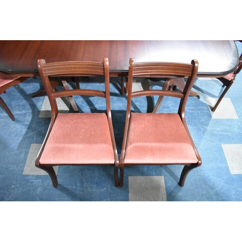 424 - An Oval Mahogany extending Dining Table with One Extra Leaf together with a Set of Six Chairs