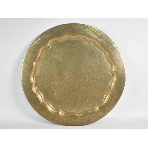 121 - A Large Indian Brass Benaries Tray Top with Engraved Foliate Decoration, 58cms Diameter