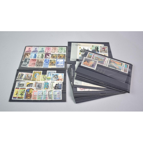 124 - Two Stamp Stock Books Containing World Stamps and a Stanley Gibbons British Stamp Catalogue for 2010