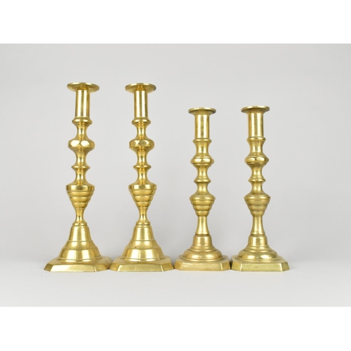 130 - Two Pairs of 19th Century Brass Candlesticks, 29cms and 25cms High