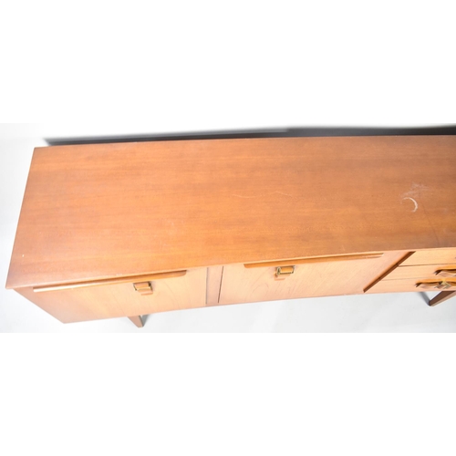 141 - A Mid Century Beautility Teak Sideboard with Three Drawers and Cupboards, 184cms Wide