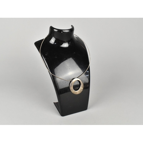 355 - A Circular Silver Pendant (40mm Wide Max) by Ian David Young, Dated London 2000, on a Silver Wire Ne... 