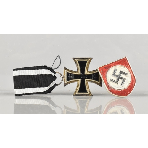 4 - A WWI German Iron Cross (Second Class) together with a Swastika Mount and a White Metal Nazi Medalli... 