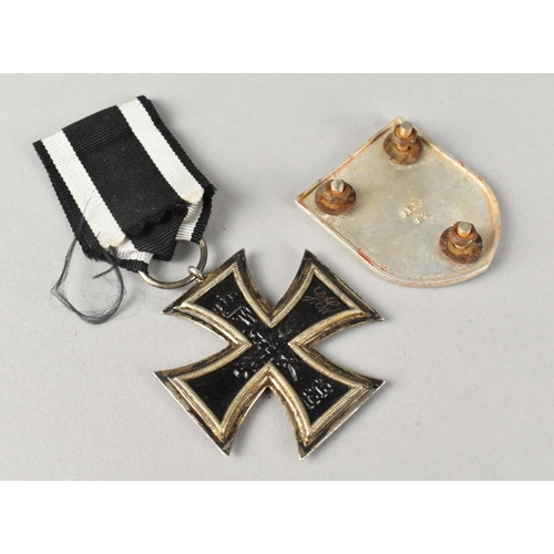 4 - A WWI German Iron Cross (Second Class) together with a Swastika Mount and a White Metal Nazi Medalli... 