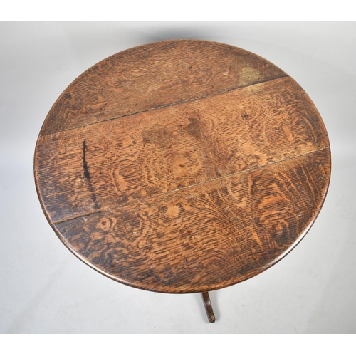 423 - A 19th Century Oak Snap Top Tripod Table with Birdcage Support, 74cms Diameter