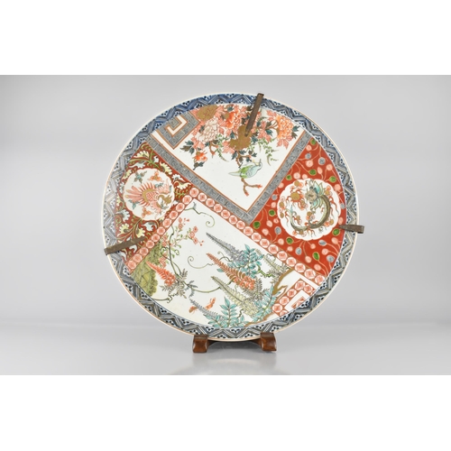 194 - A Large Japanese Meiji Period Porcelain Charger Decorated in the Imari Palette with Various Panels D... 