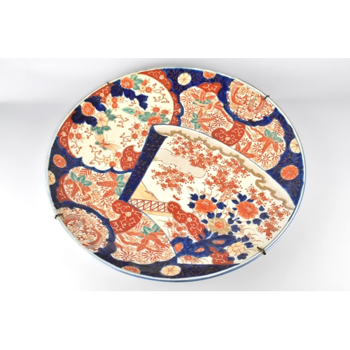 195 - A Large Japanese Meiji Period Imari Charger Decorated with Various Panels to Include Scroll Shaped D... 