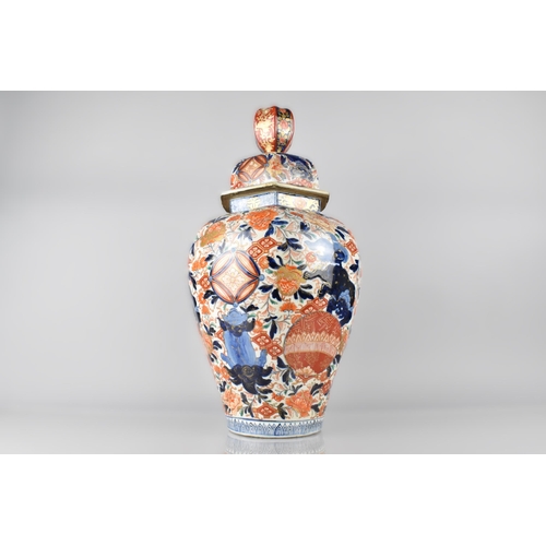 196 - A Large Japanese Meiji Period Porcelain Baluster Vase and Cover Decorated in the Imari with Temple L... 