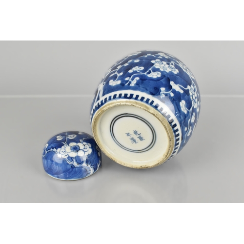 180 - A Chinese Qing Dynasty Porcelain Blue and White Prunus Pattern Ginger Jar and Cover with Four Charac... 