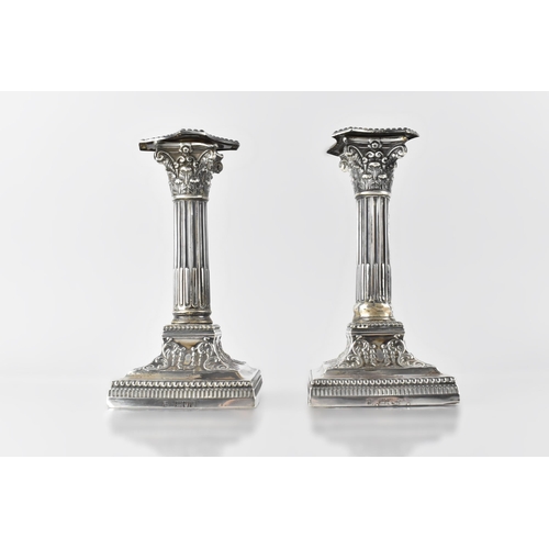 134 - A Pair of Late Victorian Silver Corinthian Column Candlesticks by Goldsmiths & Silversmiths co., Lon... 