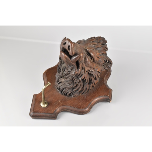 42 - A Late 19th Century/Early 20th Century Carved Wooden Wall Mounting Black Forest Boars Head on Shield... 