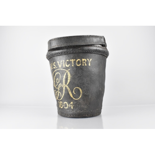 32 - A 19th Century Leather Fire Bucket Painted 'H.M.S. Victory GR 1805' In Yellow, 25cm high and with Ha... 