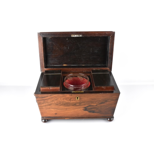 19 - A 19th Century Mahogany Sarcophagus Tea Caddy Raised on Four Bun Feet with Drop Ring Handles, the Hi... 