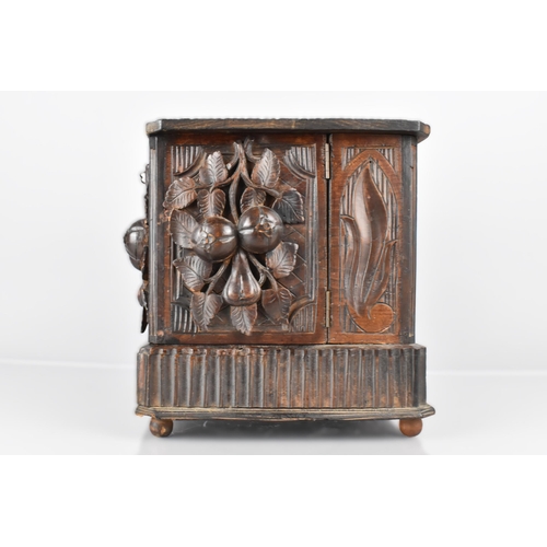 5 - A Late 19th Century Black Forest Carved Cigar Humidor Cabinet with Lift Up Lid, Hinged Side Quadrant... 