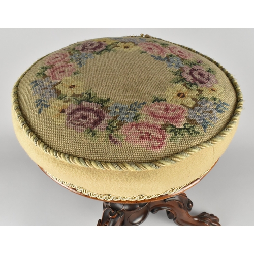 74 - A 19th Century Tapestry Topped Piano Stool with Carved Support Having Claw Feet, 50cm high and 36cm ... 