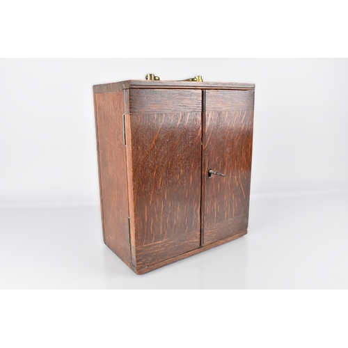 6 - An Edwardian Oak Table Top Decanter Cabinet, the Hinged Doors Opening to Reveal Fitted Two Store Con... 