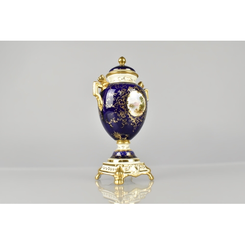 204 - A Coalport Lidded Urn Shaped Vase Decorated with Landscape Cartouche on Blue Ground with Cream Trim ... 