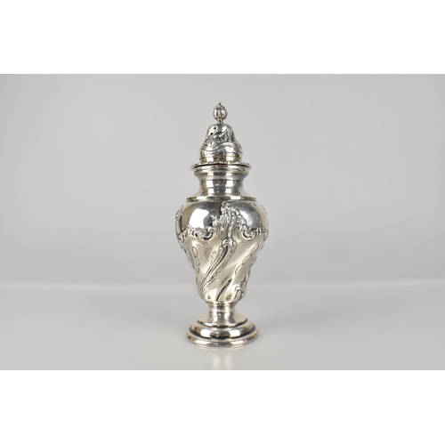 130 - A Victorian Silver Caster with Scrolled Repousse Decoration by Goldsmiths Company, London 1899, 232g... 