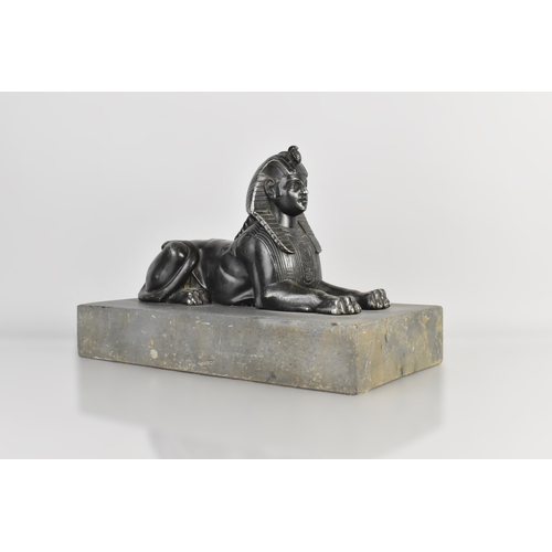 90 - A 19th Century Spelter Egyptian Sphinx Supported on a Slate Plinth, 30x15x20cm high