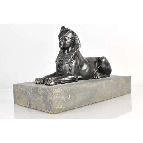 90 - A 19th Century Spelter Egyptian Sphinx Supported on a Slate Plinth, 30x15x20cm high