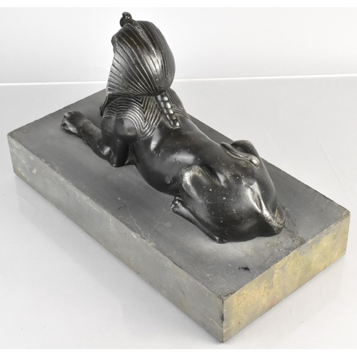 90 - A 19th Century Spelter Egyptian Sphinx Supported on a Slate Plinth, 30x15x20cm high