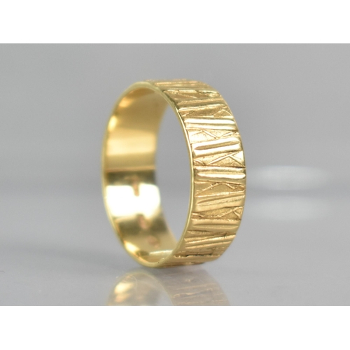 295 - An 18ct Gold Textured Wedding Band, London Hallmark for 1972 and Makers Mark EJ, 4.1gms