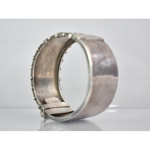 264 - A Victorian Silver Aesthetic Hinged Bangle, Central Rectangular Cartouche with Gilt Metal Ivy/Maple ... 