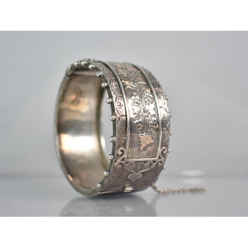 264 - A Victorian Silver Aesthetic Hinged Bangle, Central Rectangular Cartouche with Gilt Metal Ivy/Maple ... 