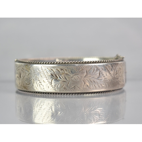 258 - A Vintage Silver Hinged Bangle having Engraved Floral Decoration with Rope Twist Edge, Stamped Inter... 