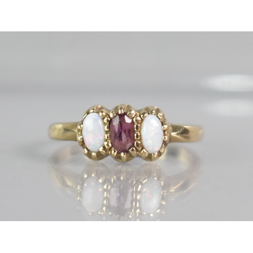 266 - An Opal and Amethyst Ladies Dress Ring, Central Mixed Oval Cut Amethyst Measuring 4.5mm by 2.7mm App... 