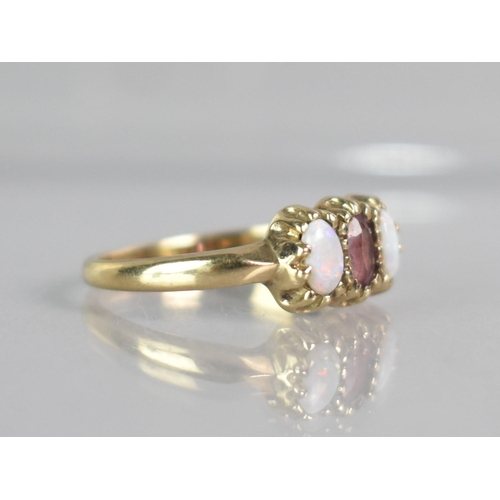 266 - An Opal and Amethyst Ladies Dress Ring, Central Mixed Oval Cut Amethyst Measuring 4.5mm by 2.7mm App... 