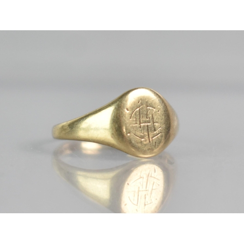 300 - A 9ct Gold Signet Ring, Oval Head Engraved with Initials but Rubbed, Tapered Shoulders to a Plain Po... 