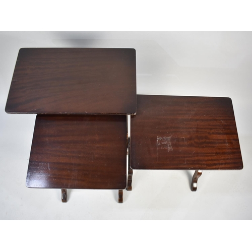 107 - A Modern Nest of Three Mahogany Tables with Pierced Supports, 53cms Wide