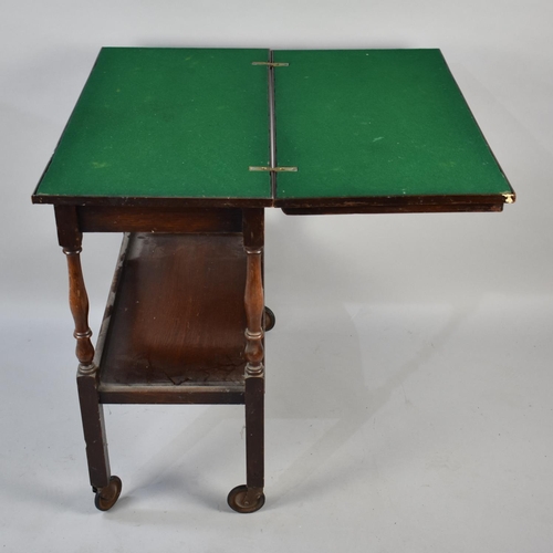 110 - A Mid 20th Century Two Tier Lift and Twist Games Trolley with Beize Top, 72cms Wide