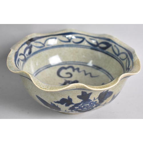 115 - A Crackle Glazed Chinese Blue and White Bowl, with Wavy Rim, 18cms Diameter, Four Character Mark to ... 