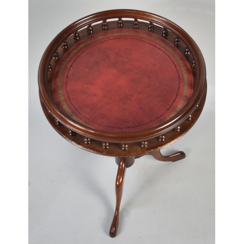 124 - A Reproduction Circular Galleried Wine Table on Tripod Base with Tooled Leather Top, 40cms Diameter