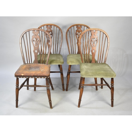 501 - A Set of Four Oak Hoop Back Side Chairs with Pierced Fleur De Lys Splat