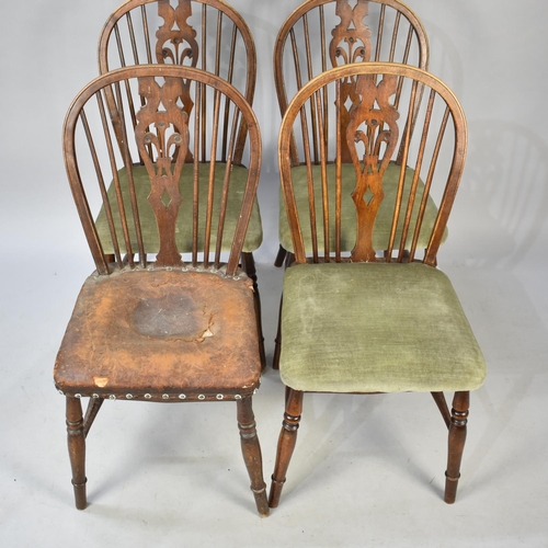 501 - A Set of Four Oak Hoop Back Side Chairs with Pierced Fleur De Lys Splat