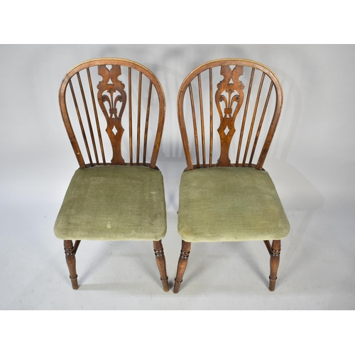 501 - A Set of Four Oak Hoop Back Side Chairs with Pierced Fleur De Lys Splat