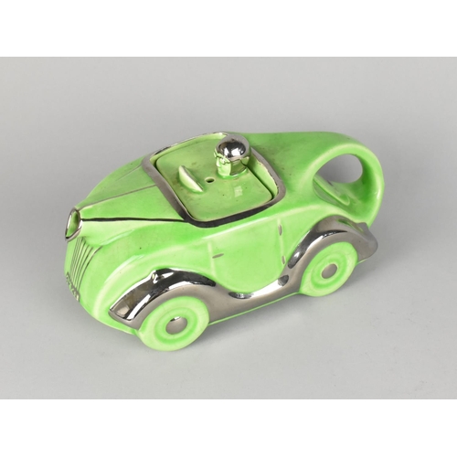 62 - A Novelty Teapot in the Form of a Vintage Green Glazed Racing Car, 22cms Long