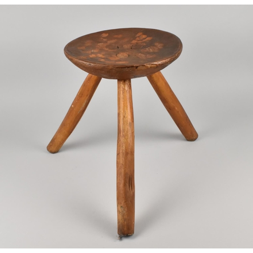 401 - A Rustic Three Legged Circular Seated Stool with Chip Carved Seat, 25.5cms Diameter and 35cms High