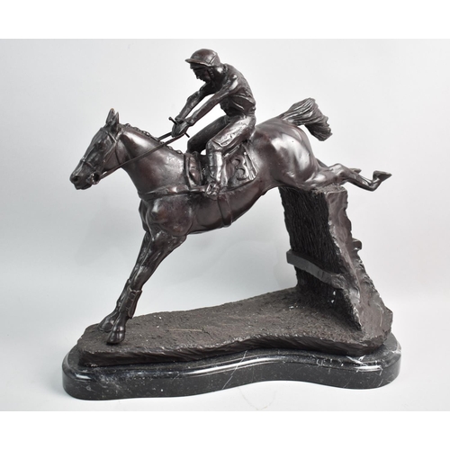 431 - A Bronze Study of Racehorse and Jockey Taking Fence, 32cms High