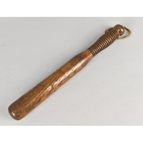 An Early 20th Century Turned Wooden Truncheon with Ribbed Handle, 33cms Long