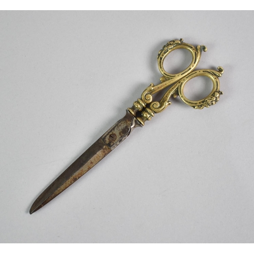 19 - A Pair of Victorian Brass Handled Chatelaine Scissors in Tapering Embossed Sheath Decorated in Relie... 