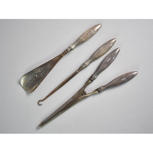 32 - A Collection of Three Silver Handled Items, Birmingham 1909, Glove Stretcher, Button Hook and Shoe H... 